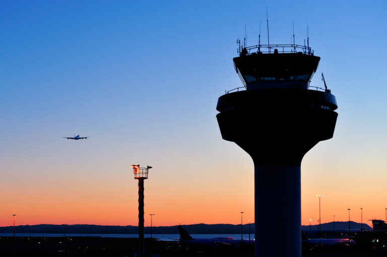 Air traffic control tower at sunset